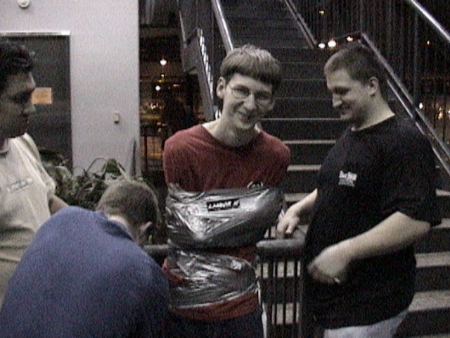 The nostalgic "LAN Party Gamer Duct-Taped to Ceiling" from another Guy Taped To Ceiling Lan Party